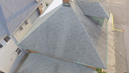 Residential roof replacement with architectural shingles on brick home